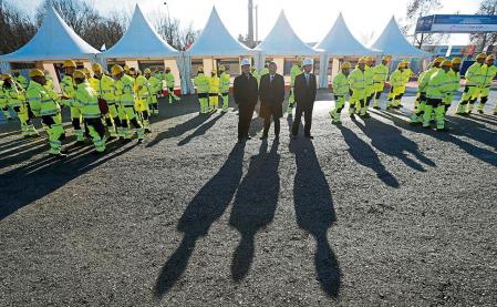 Workers and officials await the ceremony of the reconstruction of a railway line between Budapest and Belgrade, in Belgrade, Serbia, Tuesday, Nov. 28, 2017. Reconstruction of a railway line between Budapest and Belgrade, a project financed mainly by China, as a 